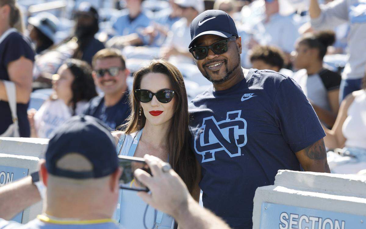 North Carolina fan Emeric Tate has his photo taken with Jordon Hudson before UNC’s game against Clemson at Kenan Stadium in Chapel Hill, N.C., Sat. Oct. 4, 2025.