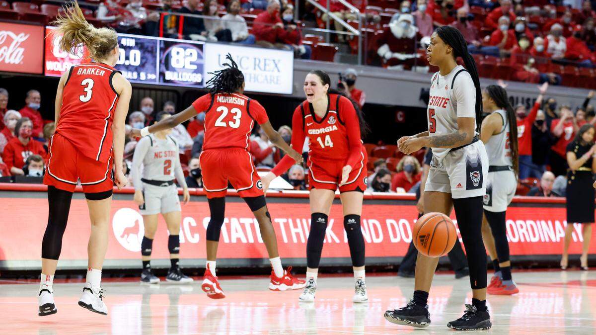 N.C. State’s Jada Boyd (5) walks off the court as time expires in overtime during Georgia’s 82-80 overtime victory over N.C. State at Reynolds Coliseum in Raleigh, N.C., December 16, 2021.