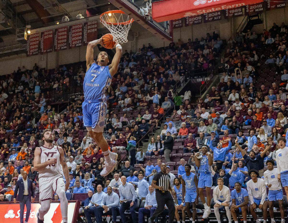 North Carolina guard Seth Trimble (7) soars to the basket for a dunk on a fast break in the second half against Virginia Tech on Tuesday, March 3, 2025 at Cassell Coliseum in Blacksburg, Va. Trimble scored 17 points in the Tar Heels’ 91-59 victory.