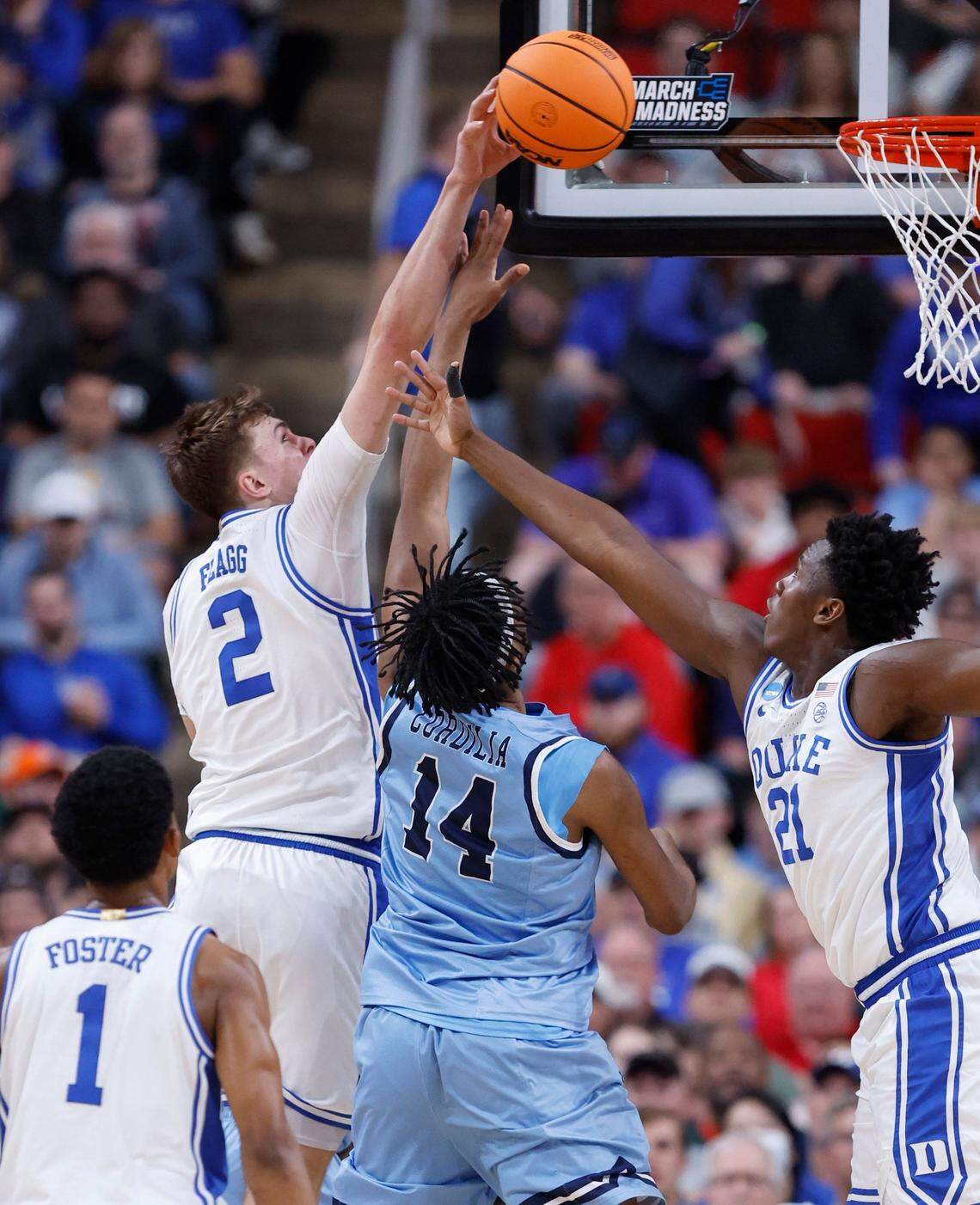 Duke’s Cooper Flagg (2) blocks the shot by Mount St. Mary’s Jedy Cordilia (14) during the first half of Duke’s game against Mount St. Mary’s in the first round of the 2025 NCAA Men’s Basketball Tournament at the Lenovo Center in Raleigh, N.C., Friday, March 21, 2025.
