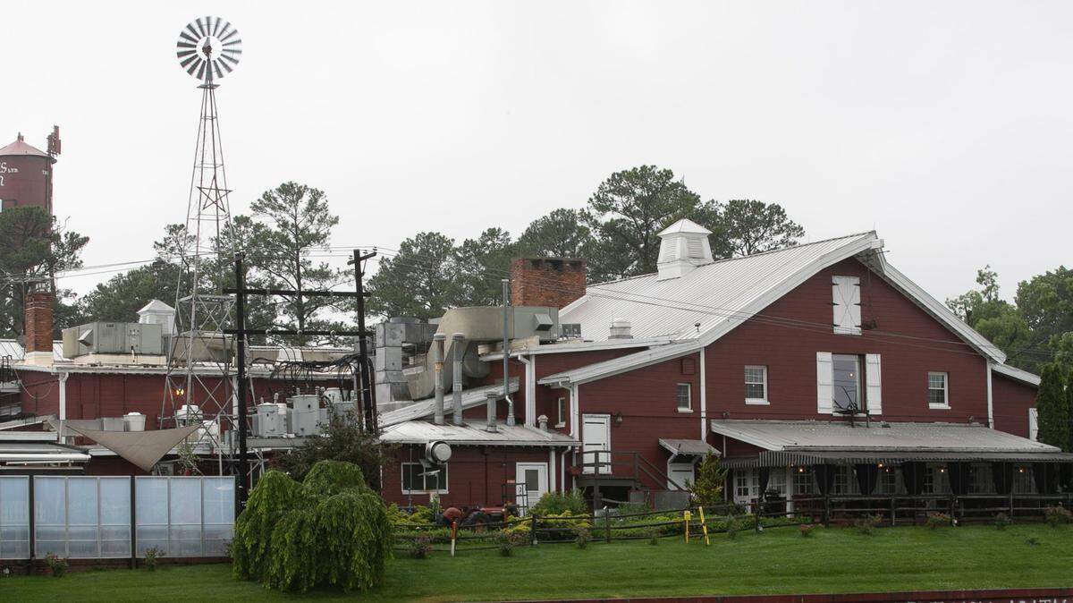 Angus Barn owner Van Eure has painted a welcoming message on the front of her restaurant on Glenwood Ave. on Tuesday, May 19, 2020 in Raleigh, N.C. Eure and her staff are preparing to open their dining rooms in anticipation of Gov. Roy Cooper lifting his coronavirus restrictions.