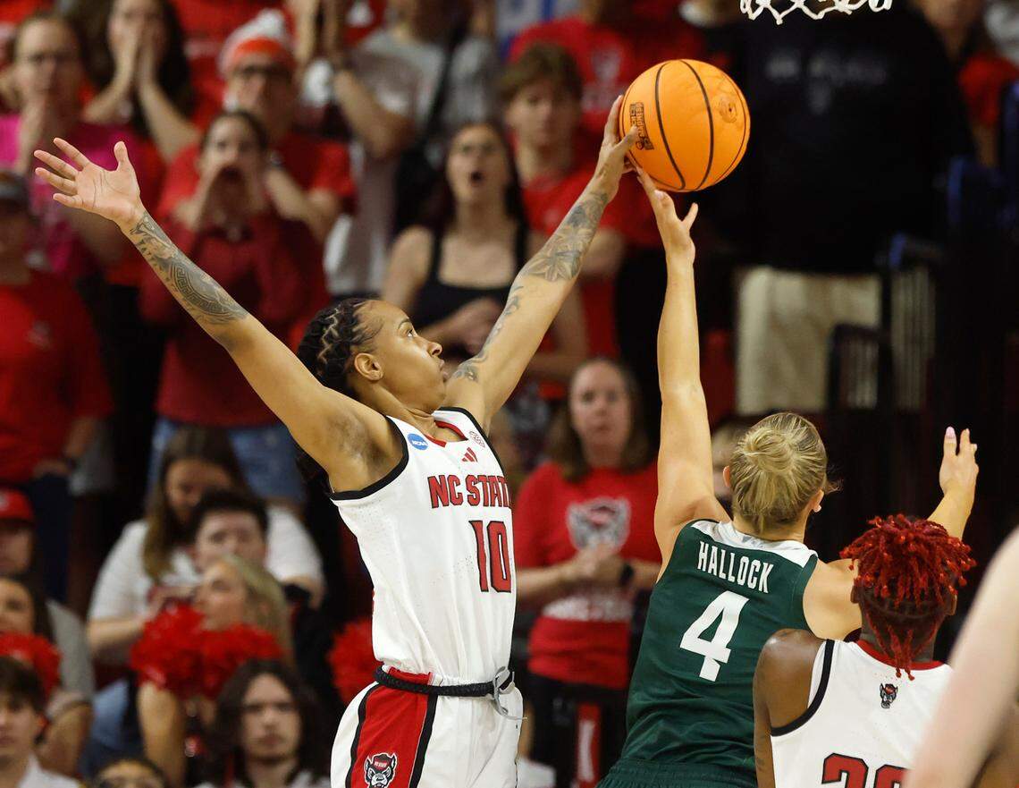 N.C. State’s Aziaha James blocks a shot by Michigan State’s Theryn Hallock during the first half of the Wolfpack’s 83-49 victory in the second round of the NCAA Tournament on Monday, March 24, 2025, at Reynolds Coliseum in Raleigh, N.C.