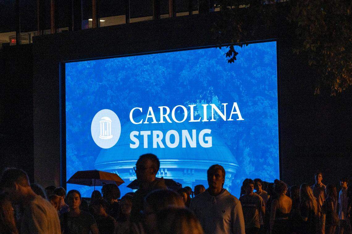 UNC-Chapel Hill leave a candlelight vigil Friday, Aug 30, 2023 at the Dean Smith Center in honor of professor Zijie Yan who was shot and killed on campus on Monday.