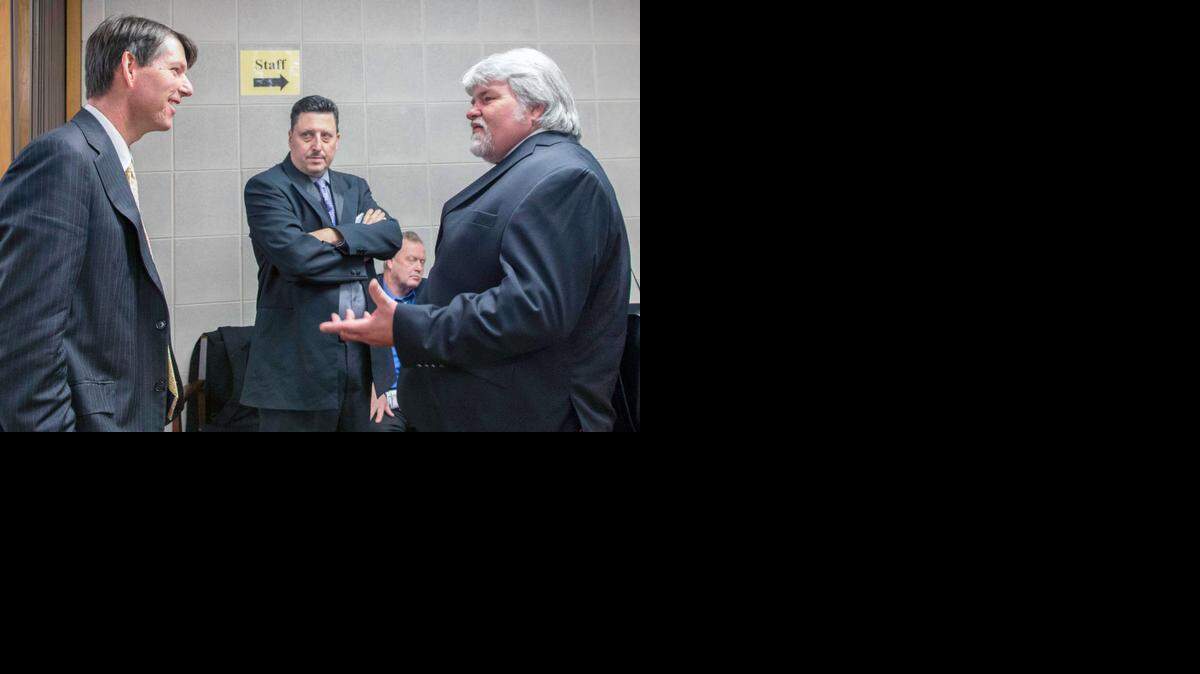 Gordon Myers, left, executive director of the state’s wildlife commission, speaks with Carl “Skip” West of the North American Deer Farmers Association.

