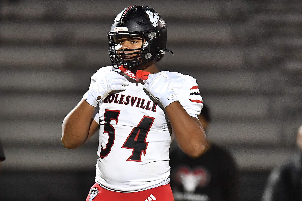 Rolesville defensive lineman Malachi Harris (54) looks to the sidelines during pregame drills before their playoff matchup against Apex Friendship. The Apex Friendship Patriots and the Rolesville Rams met in  the second round of the  NCHSAA 8A Playoff game in Apex, N.C. on November 14, 2025. Rolesville wins 14-7 in overtime.