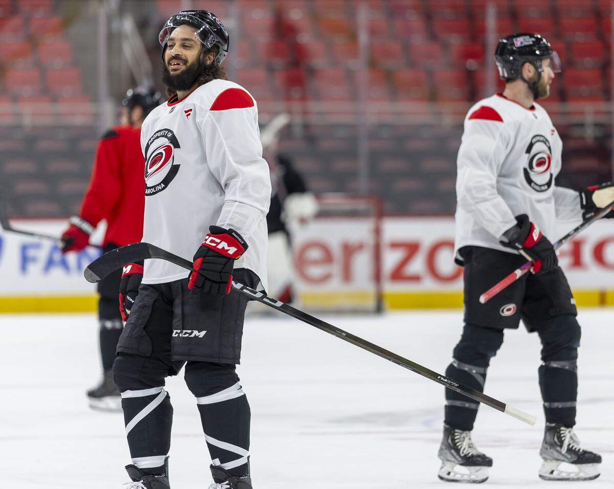 Defensemen Jalen Chatfield (5) and Jacoob Slavin (74) skate during the Carolina Hurricanes practice on Friday, May 15, 2026 at Lenovo Center in Raleigh, N.C.