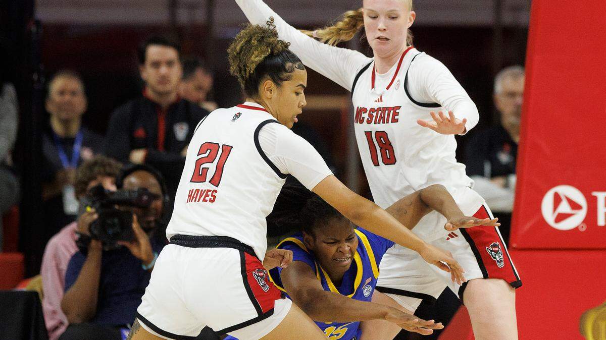 N.C. State’s Madison Hayes and Tilda Trygger pressure Pittsburgh’s Khadija Faye during the second half of the Wolfpack’s 83-67 win on Thursday, Jan. 16, 2025, at Reynolds Coliseum in Raleigh, N.C.