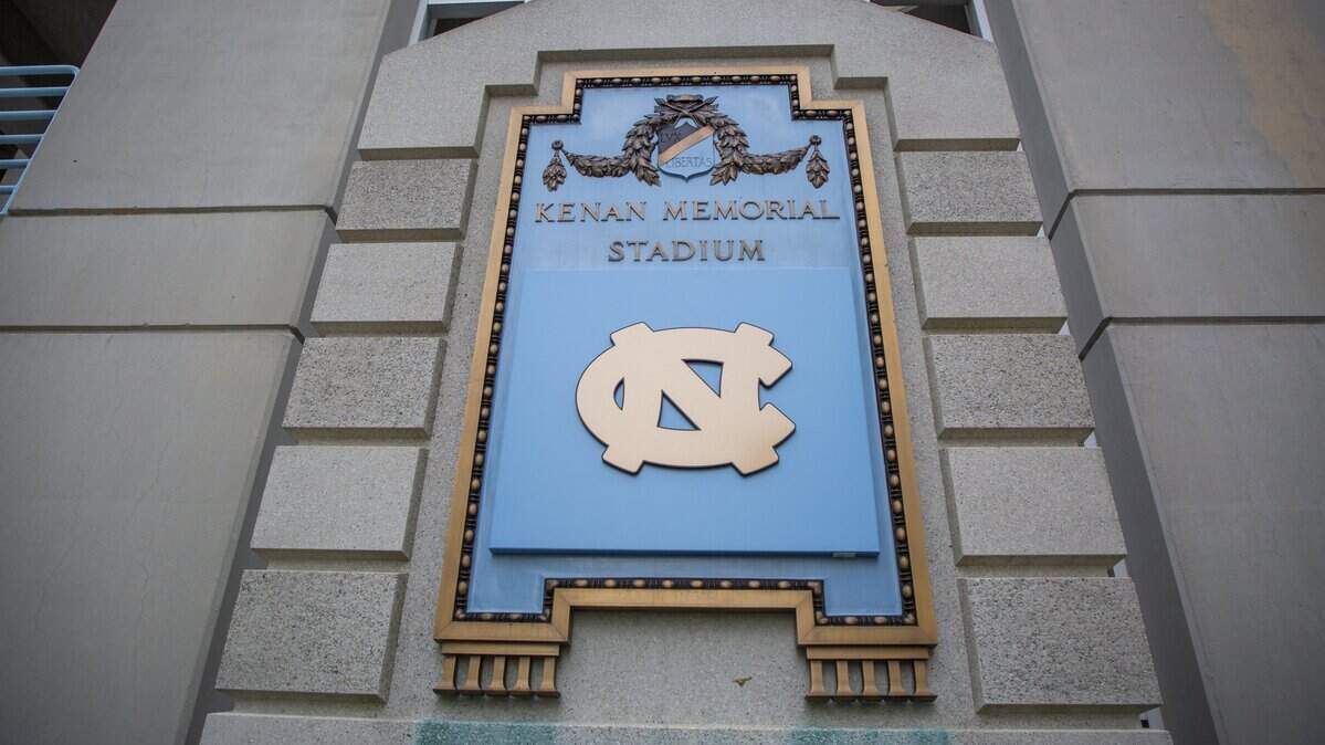 A plaque commemorating William Rand Kenan Sr., known to have a racist history, at Kenan Memorial Stadium has been covered by the UNC-Chapel Hill logo. Photo taken Thursday, Nov. 7, 2019, in Chapel Hill, NC.