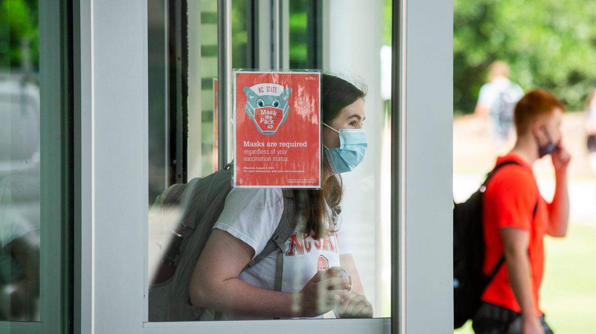 Attending college during a pandemic added pressure for students. In this Aug. 16, 2021 photo N.C. State students enter and exit the Talley Student Union in Raleigh. It was the first day of fall semester and masks where required.