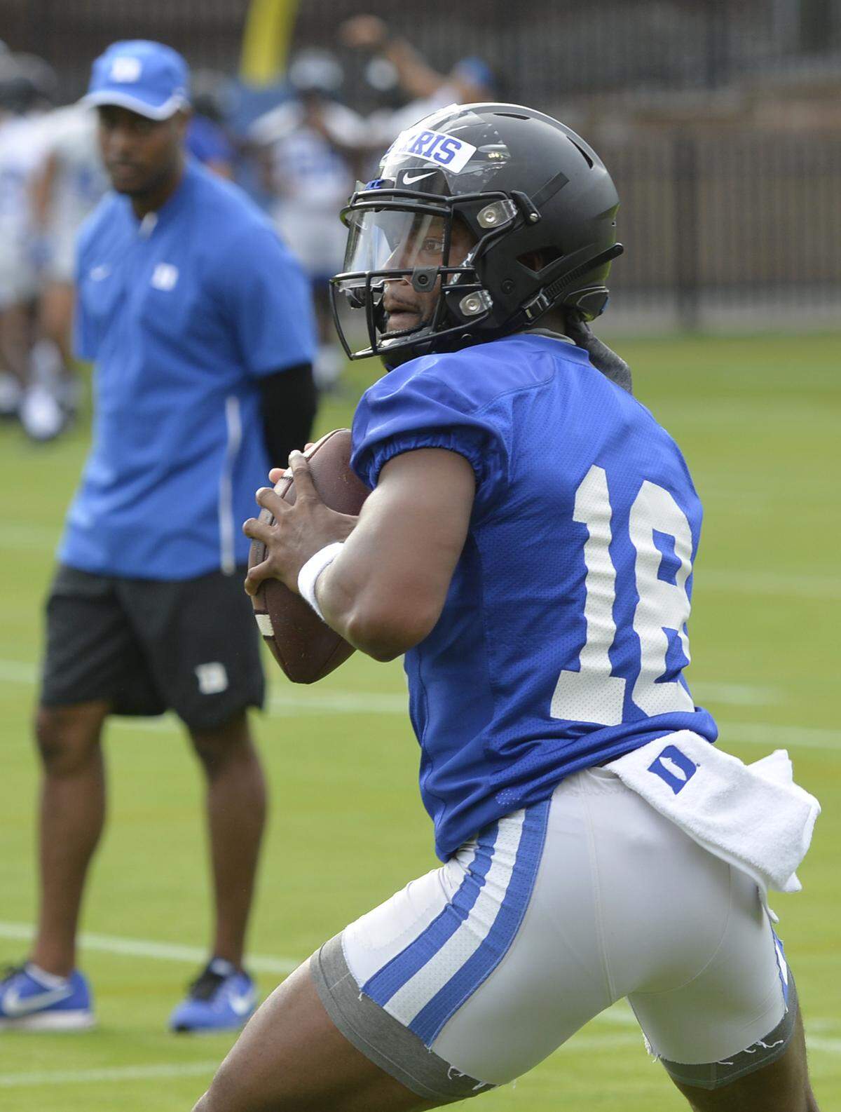 Quarterback Quentin Harris drops back to pass during drills as Duke holds its first football practice of the season Friday, August 2, 2019.