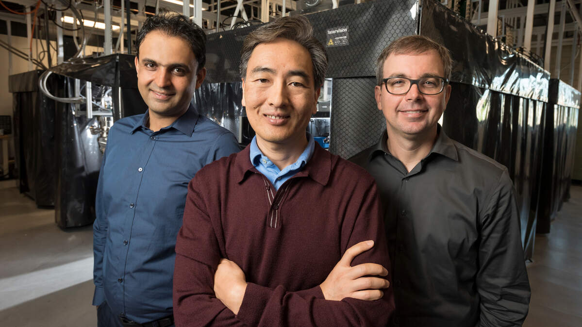 Duke University professors Iman Marvian, Jungsang Kim and Kenneth Brown gathered in 2018 at Kim’s ion-trap quantum lab in the Chesterfield Building in downtown Durham.