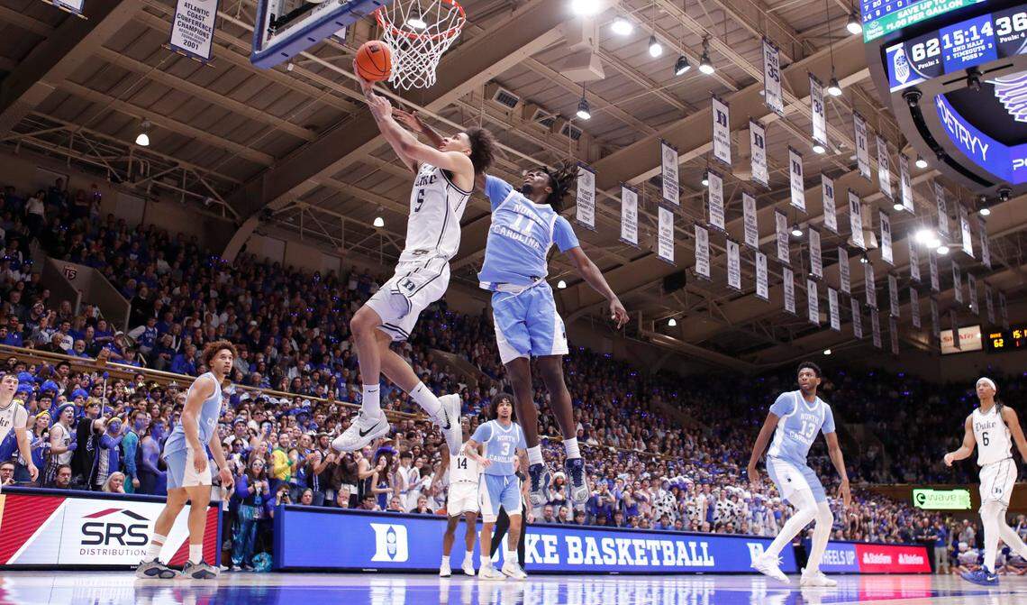 Duke’s Tyrese Proctor (5) drives to the basket past North Carolina’s Ian Jackson (11) during Duke’s 87-70 victory over UNC at Cameron Indoor Stadium in Durham, N.C., Saturday, Feb. 1, 2025.