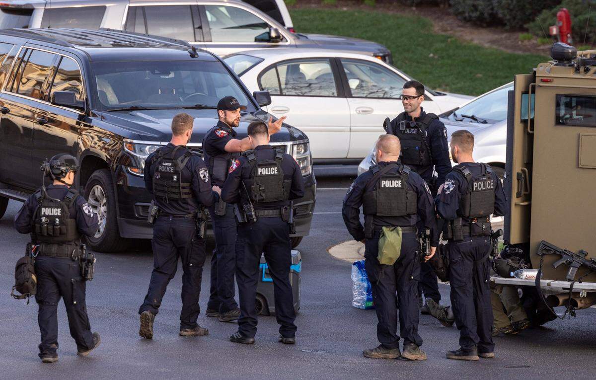 Law enforcement officers work the scene of a standoff at Tryon Villages apartments Wednesday, Feb. 22, 2023.