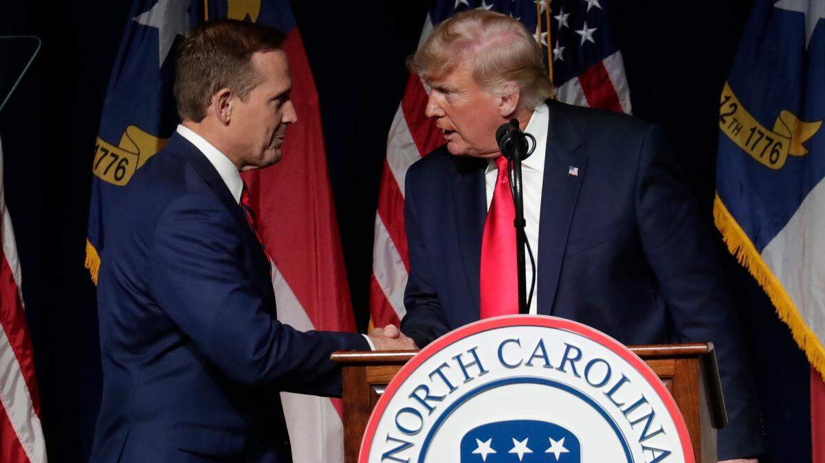 Former President Donald Trump, right, announces his endorsement of N.C. Rep. Ted Budd, left, for the 2022 North Carolina U.S. Senate seat as he speaks at the North Carolina Republican Convention Saturday, June 5, 2021, in Greenville, N.C.