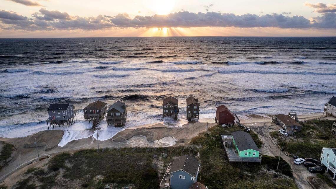 Surf edges towards homes in Rodanthe Friday, Sept, 15, 2023 as Hurricane Lee churns in the Atlantic hundreds of miles offshore.
