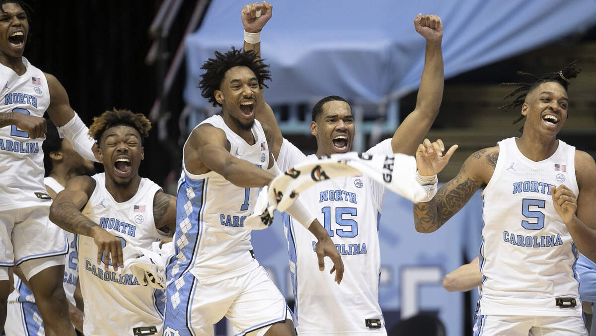 North Carolina’s Caleb Love (2), Anthony Harris (0),Leaky Black (1), Garrison Brooks (15) and Armando Bacot (5) react as time expires and celebrate their 91-73 victory over Duke on Saturday, March 6, 2021 at the Smith Center in Chapel Hill, N.C.