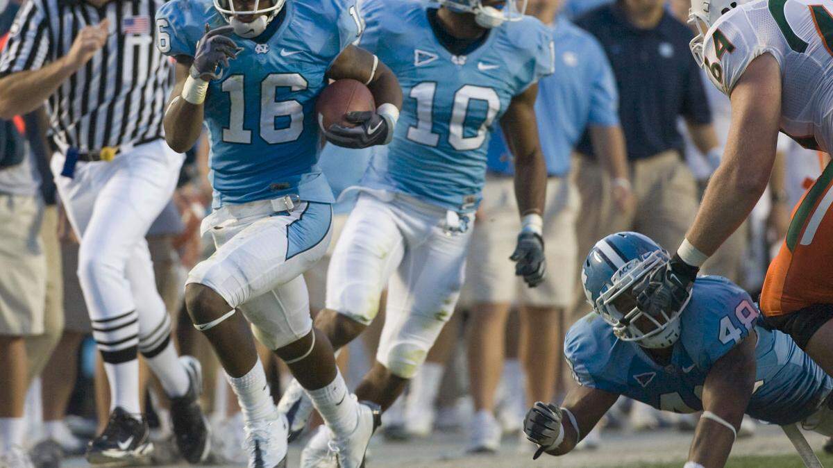 UNC’s Kendric Burney (16) returns an pass interception for a touchdown in the second quarter to give the Tar Heels a 20-7 lead over Miami at the half on Saturday November 14, 2009 at Kenan Stadium in Chapel Hill, N.C. . ROBERT WILLETT -robert.willett@newsobserver.com