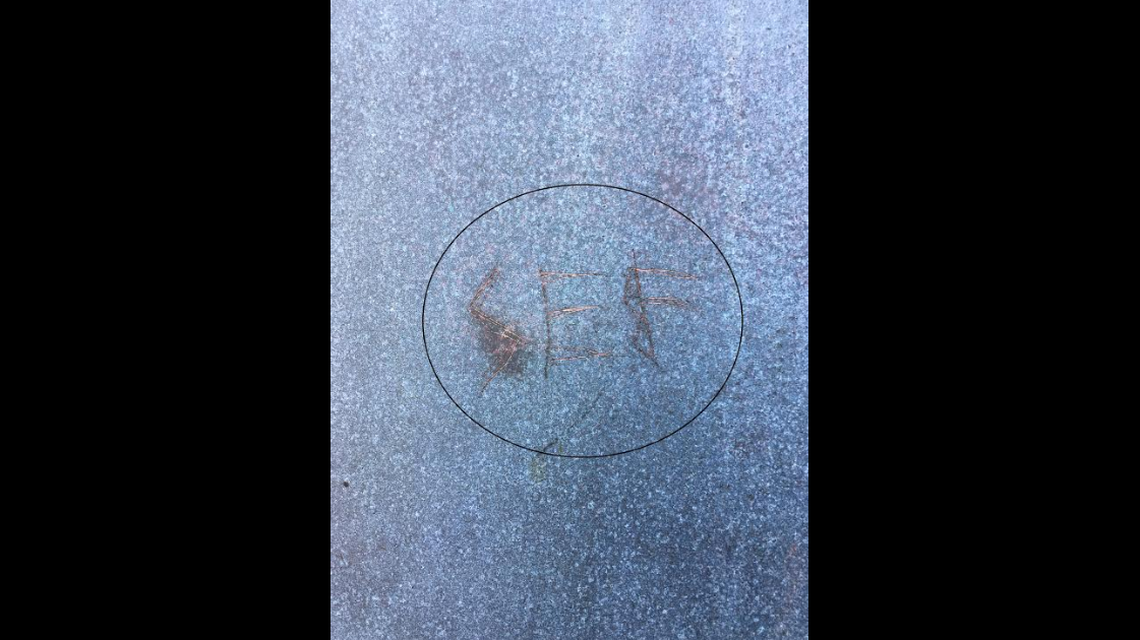 A North Carolina man carved letters into a historic lighthouse on the Outer Banks, officials say.