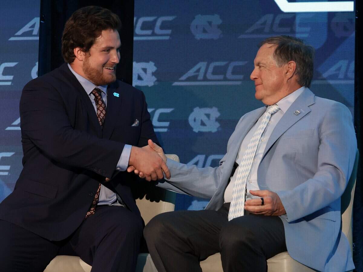 North Carolina player Christo Kelly, left shakes hands with head coach Bill Belichick, right, after speaking during the 2026 ACC Football Kickoff program at the Charlotte Hilton Uptown hotel in Charlotte, NC on Friday, July 17, 2026.