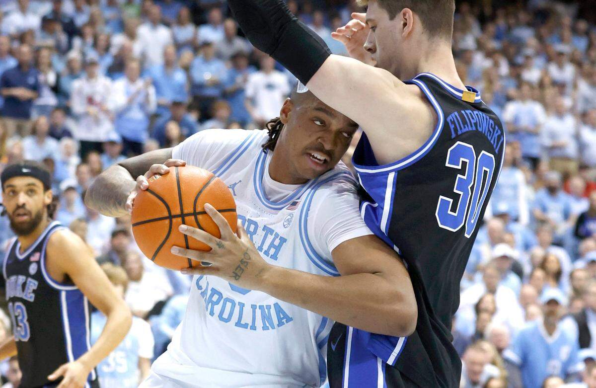 North Carolina’s Armando Bacot (5) works against Duke’s Kyle Filipowski (30) during the first half of UNC’s game against Duke at the Smith Center in Chapel Hill, N.C., Saturday, March 4, 2023.