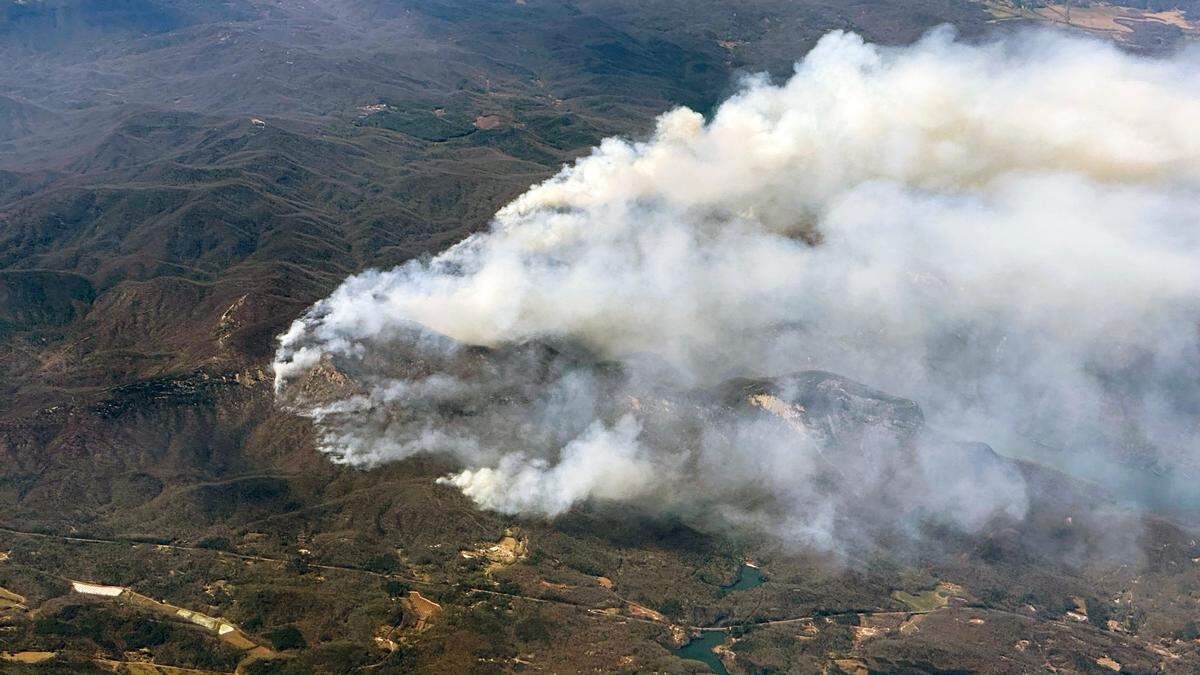 An aerial view shows heavy smoke from a wildfire burning in Jackson County, one of several burning in Western North Carolina, Friday afternoon, March 28, 2025