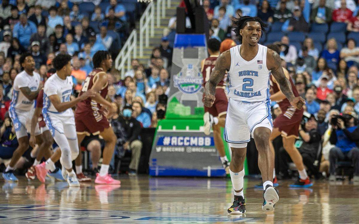North Carolina’s Caleb Love (2) reacts after sinking s three point shot against Boston College’s DeMarr Langford Jr. (5) during the first half in the second round of the ACC Tournament on Wednesday, March 8, 2023 at the Greensboro Coliseum in Greensboro, N.C.