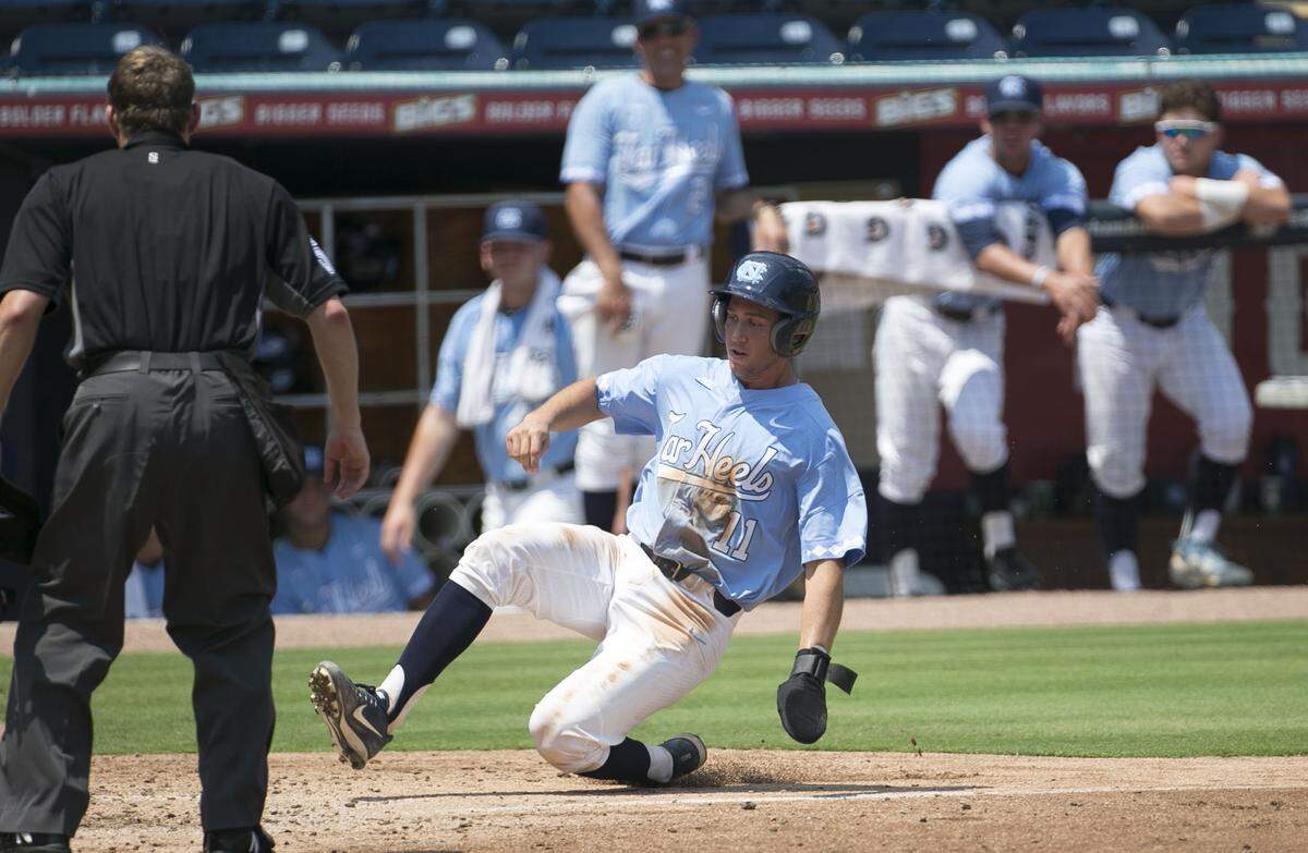 North Carolina’s Cody Roberts (11) scores on a single by Ike Freeman in the third inning to tie Duke 1-1 on Sunday, May 13, 2018 at Durham Bulls Athletic Park in Durham, N.C.
