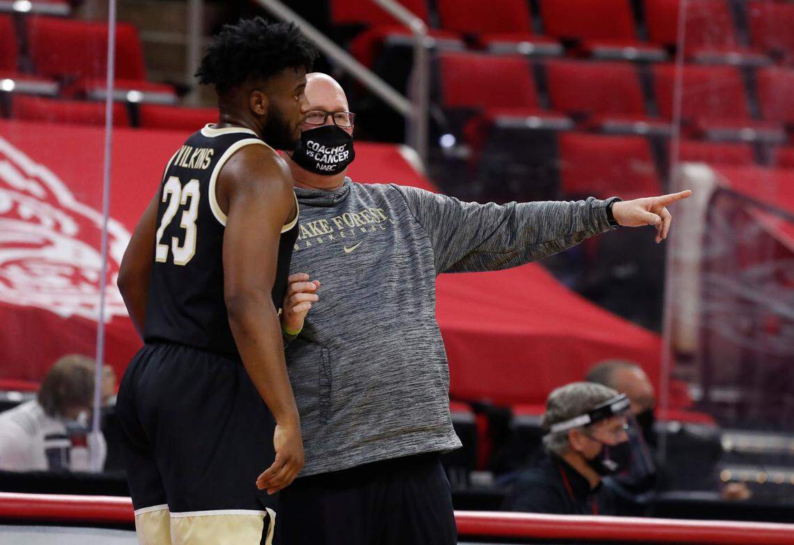 Wake Forest head coach Steve Forbes talks with Isaiah Wilkins (23) during the first half of N.C. State’s game against Wake Forest at PNC Arena in Raleigh, N.C., Wednesday, January 27, 2021.