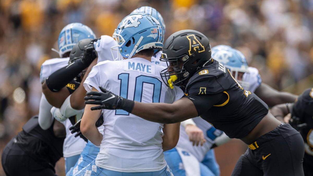 Appalachian States Nick Hampton (9) sacks North Carolina quarterback Drake Maye (10) in the first quarter on Saturday, September 3, 2022 at Kidd Brewer Stadium in Boone, N.C.