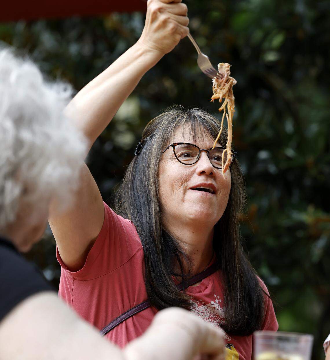 Cami Hook enjoys hand pulled barbecue while having lunch with family at Picnic in Durham, N.C. Saturday, August 23, 2025. The restaurant specializes in whole hog barbecue.