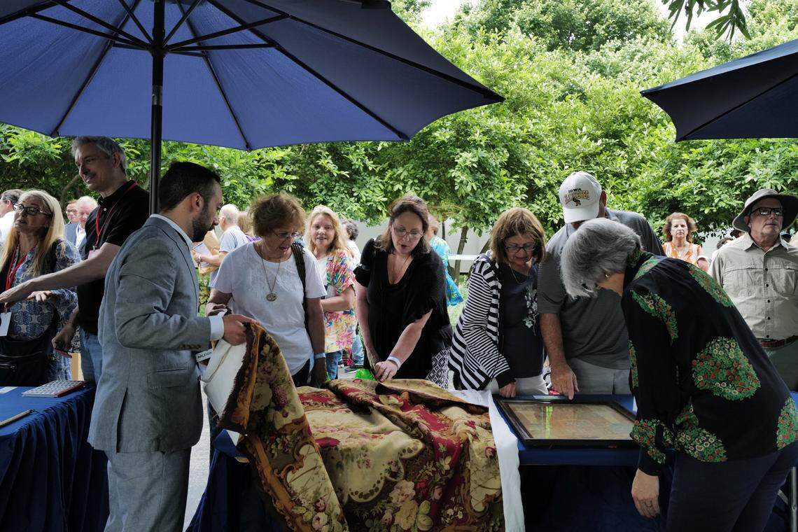 Guests receive appraisals of their paintings and drawings at a taping of the PBS hit series “Antiques Roadshow” at the North Carolina Museum of Art on Tuesday, May 16, 2023 as part of the series 28th season tour.
