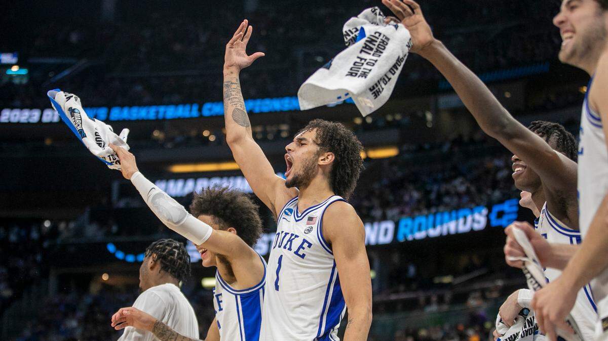Duke’s Dereck Lively II (1) leads the celebration on the bench after a basket by reserve player Kale Catchings (12) to give the Blue Devils’ a 74-50 lead with :38 seconds to play against Oral Roberts during the first round of the NCAA Tournament on Thursday, March 16, 2023 at the Amway Center in Orlando, Fla.