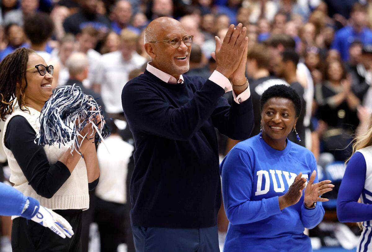 Duke’s C.B. Claiborne, the Blue Devils’ first Black basketball player, acknowledges the crowd as he is honored during the first half of Duke’s game against Louisville at Cameron Indoor Stadium in Durham, N.C., Monday, Feb. 20, 2023.