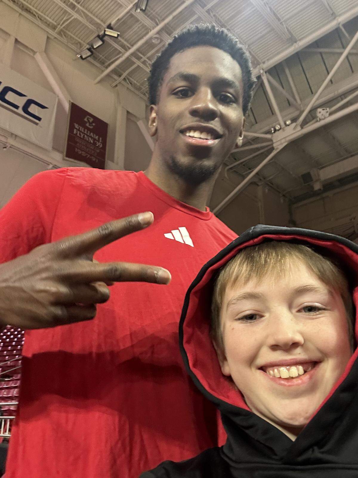 N.C. State’s Terrance Arceneaux takes a selfie with Finley Hall ahead of the Wolfpack’s men’s basketball game at Boston College on Jan. 6, 2026, in Chestnut Hill, Mass.