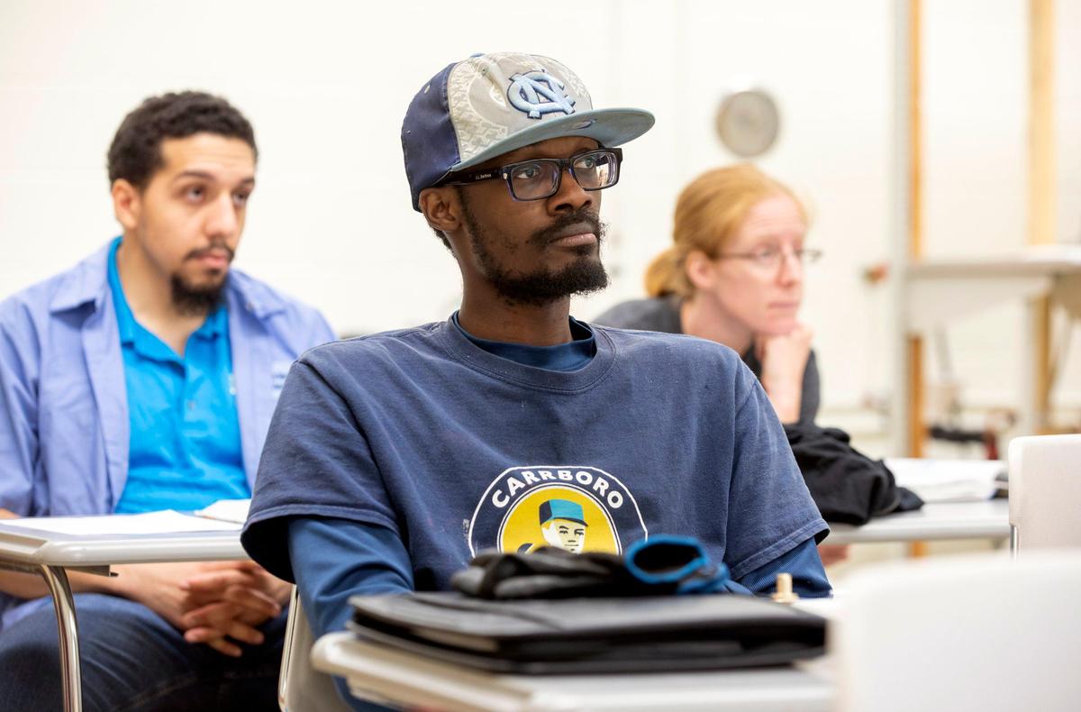 Jason Bethea listens to the instructor of a plumbing class, Robert Brewer, at Durham Technical Community College on Thursday, Aug. 30, 2019, in Durham, NC.