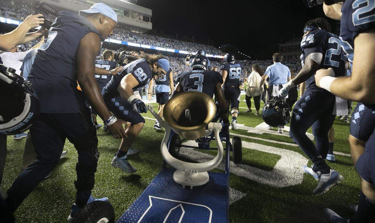 North Carolina’s Jake Bargas (80) rings the victory bell after the Tar Heels defeated Duke 20-17 on Saturday, October 26, 2019 at Kenan Stadium in Chapel Hill, N.C.