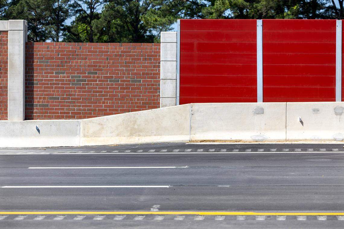 A brick noise reduction wall connects with a composite material that is used for noise reduction on bridges, due to the weight of bricks, on the newest section of N.C. 540 in southern Wake County on Tuesday, May 28, 2024.