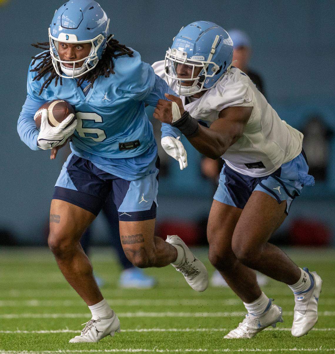 North Carolina wide receive Nate McCollum (6) looks for running room after a reception from quarterback Drake Maye on Wednesday, August 2, 2023 in Chapel Hill, N.C.