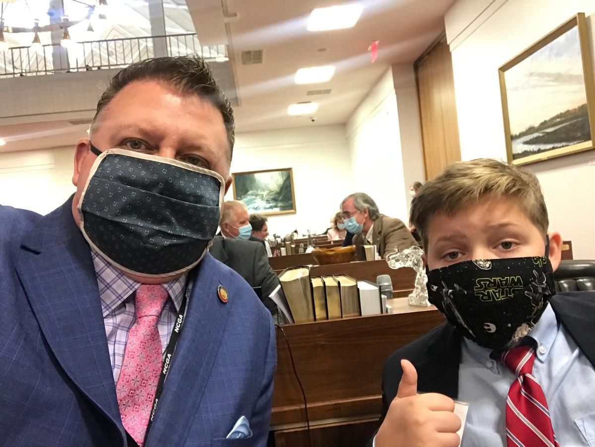 Rep. Jason Saine, a Republican from Raleigh, and his son on the NC House floor.