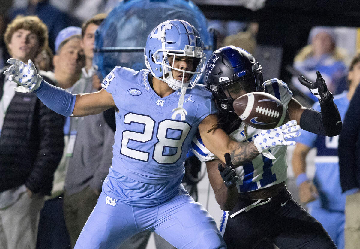 North Carolina’s Alijah Huzzie provides defensive pressure in front of Duke’s Mehki Wall during the second half of the Blue Devils’ 47-45 loss on Saturday, Nov. 11, 2023, at Kenan Stadium in Chapel Hill, N.C.
