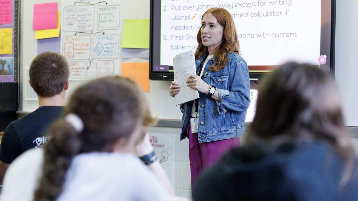 Math teacher Rachel Skipper gives instructions to students during a class on Sept. 2, 2025, at Millbrook High School in Raleigh, N.C.