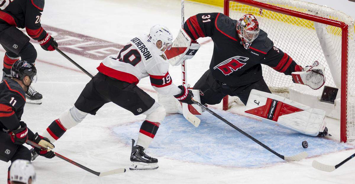 Carolina Hurricanes goalie Frederik Andersen stops a scoring attempt by Ottawa right wing Drake Batherson in the third period on Saturday, April 18, 2026, during the first round of the Stanley Cup playoffs at Lenovo Center in Raleigh, North Carolina.