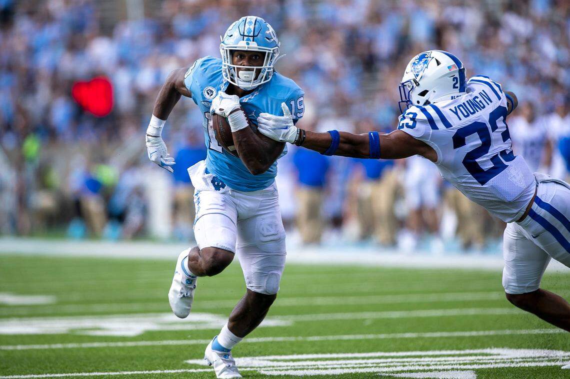 Duke’s Lummie Young IV (23) tries to stop North Carolina’s Ty Chandler (19) on a 14-yard touchdown run in the fourth quarter on Saturday, October 2, 2021 at Kenan Stadium in Chapel Hill, N.C.