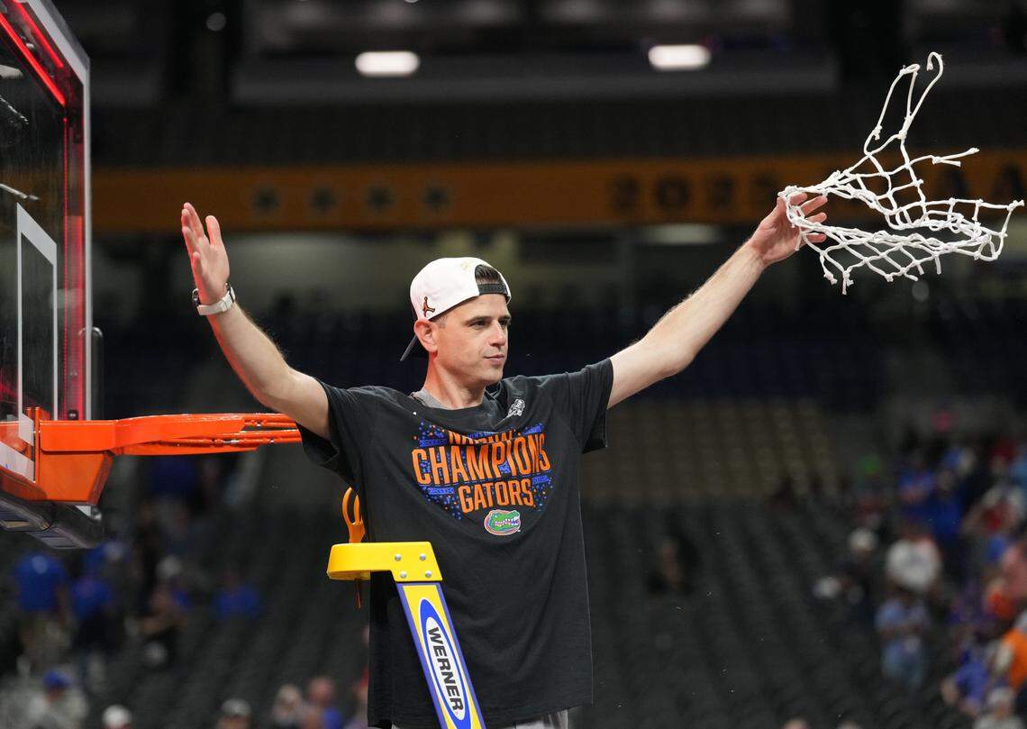 Florida Gators head coach Todd Golden cuts down the net after defeating the Houston Cougars in the national championship game of the Final Four of the 2025 NCAA Tournament at the Alamodome.