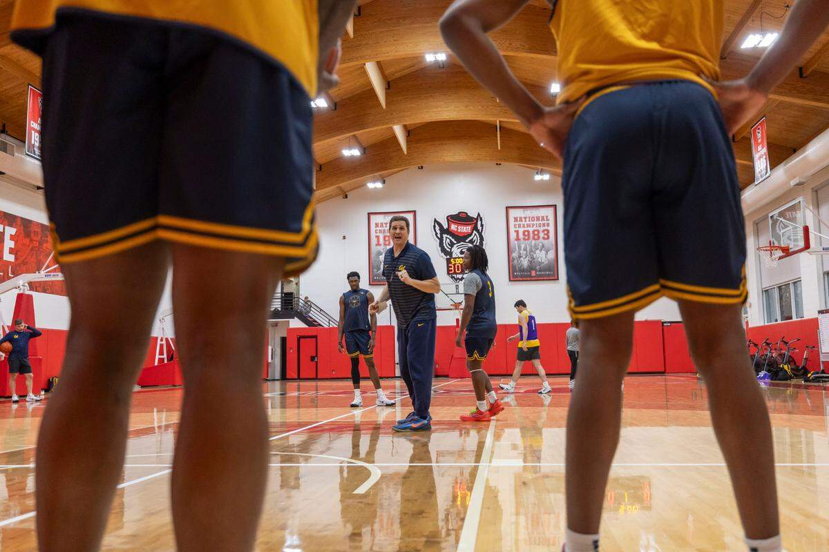 California coach Mark Madsen works with his player during their practice at N.C. State’s Dial Basketball Center on Friday, January 17, 2025 in Raleigh, N.C.
