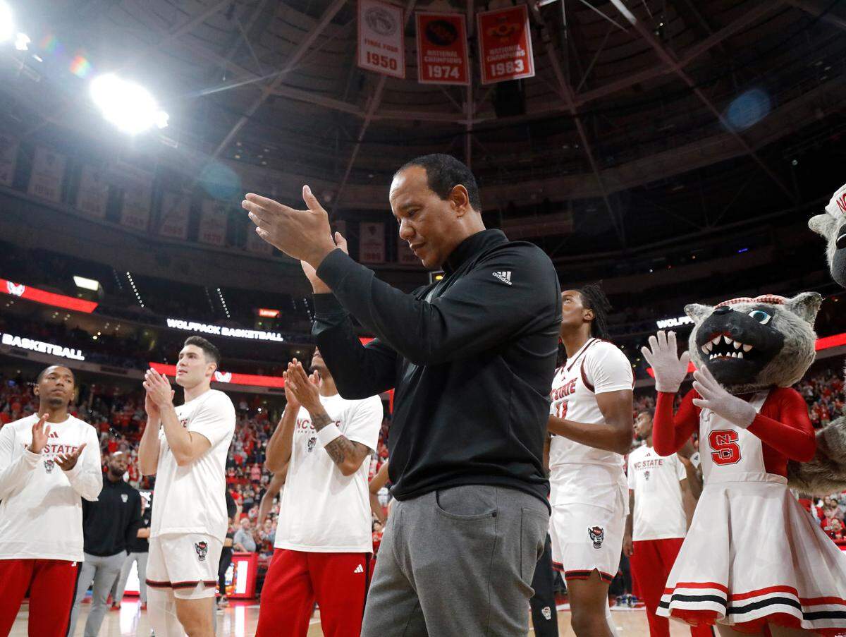 N.C. State head coach Kevin Keatts applauds during a highlight video of the Wolfpack’s 2024 postseason run prior to N.C. State’s season opening game against USC Upstate on Monday, Nov. 4, 2024, at the Lenovo Center in Raleigh, N.C. 
