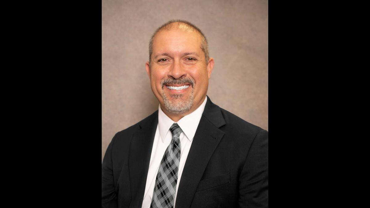 Franklinton High School Principal Russell Holloman has been suspended with pay and faces losing his job in the Franklin County school system.