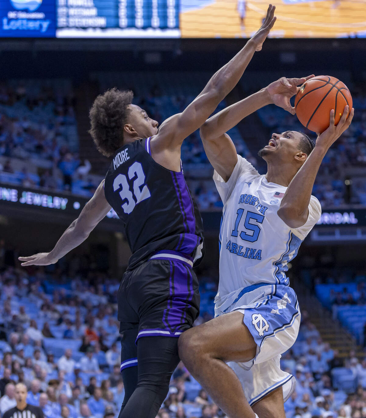 Central Arkansas guard Luke More (32) defends North Carolina forward Jarin Stevenson (15) in the first half on November 3, 2025 at the Smith Center in Chapel Hill, N.C