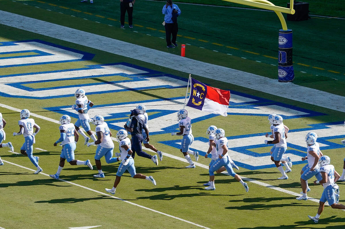 North Carolina Tar Heels take the field against the Duke Blue Devils during the first quarter at Wallace Wade Stadium. 