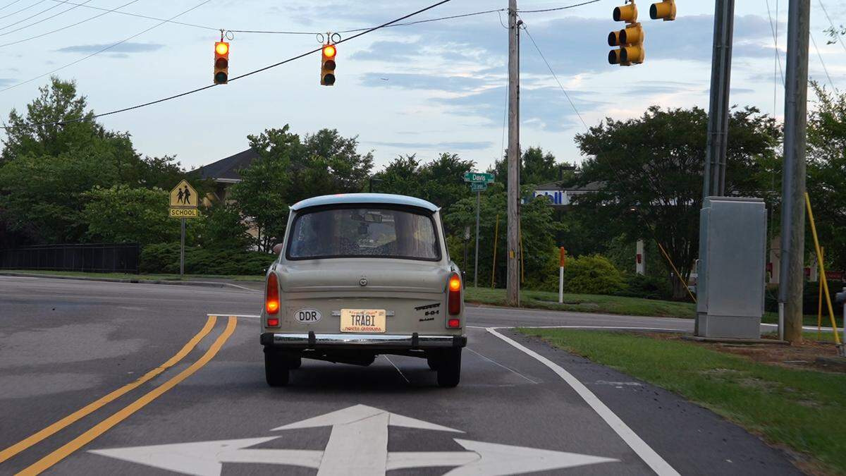Mitch and Noah Armbruster drive their Trabant to Cars and Coffee Morrisville on June 7, 2025.